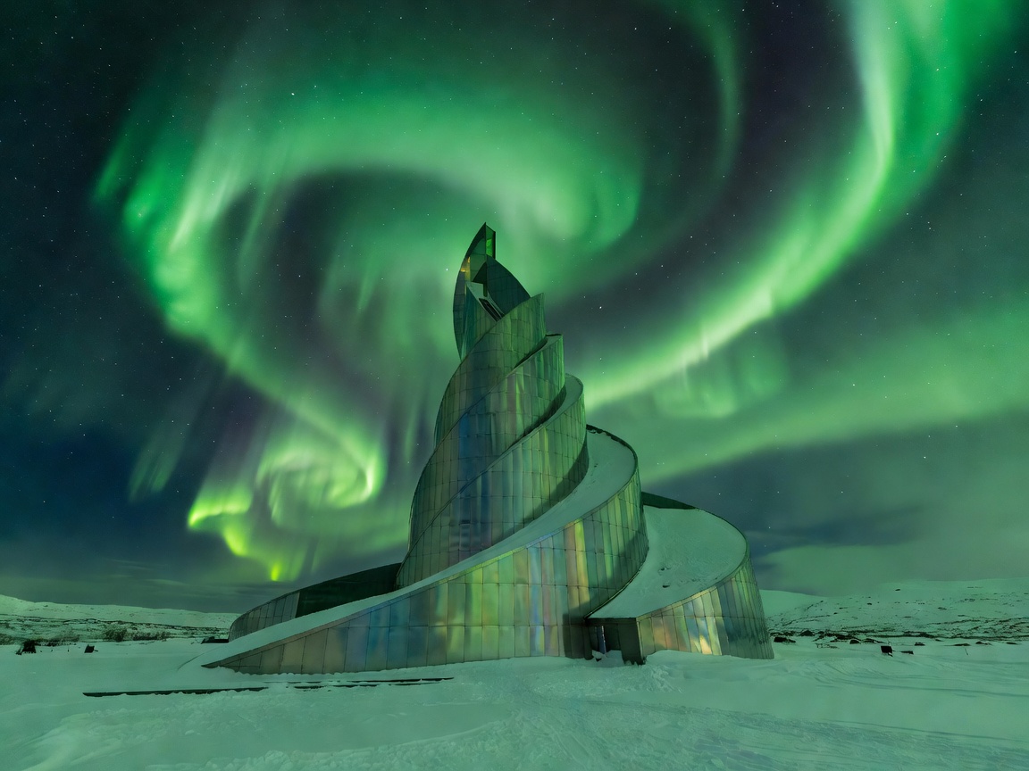 The architectural titanium spiral of the Northern Lights Cathedral in Alta with green aurora ribbons overhead
